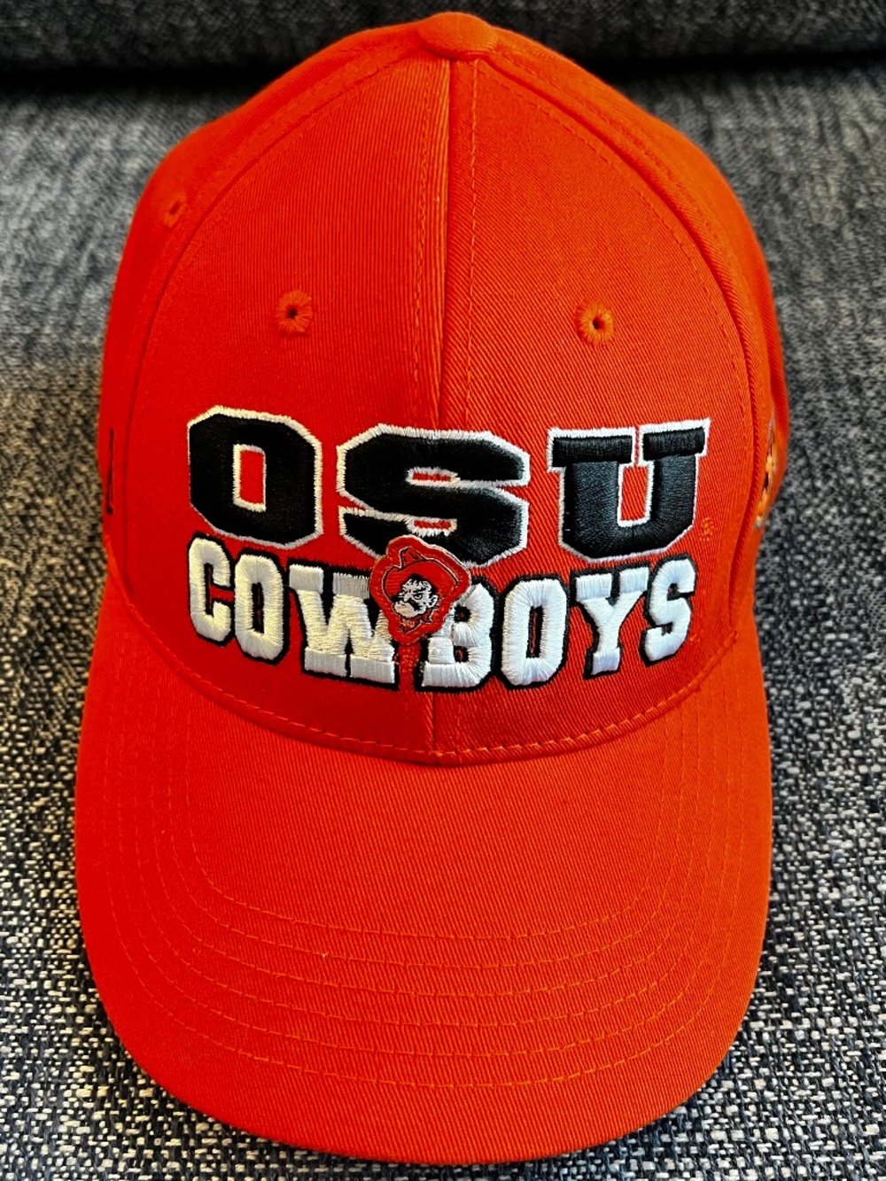 Top of the World orange cotton baseball hat with black and white OSU Cowboys.